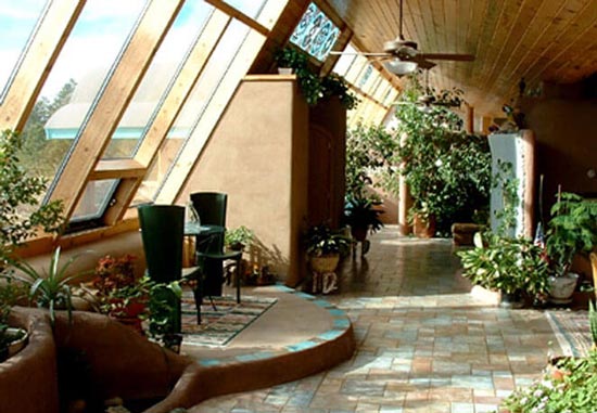 Photo of The inside atrium of an Earthship
