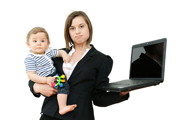 Mum holding computer and baby
